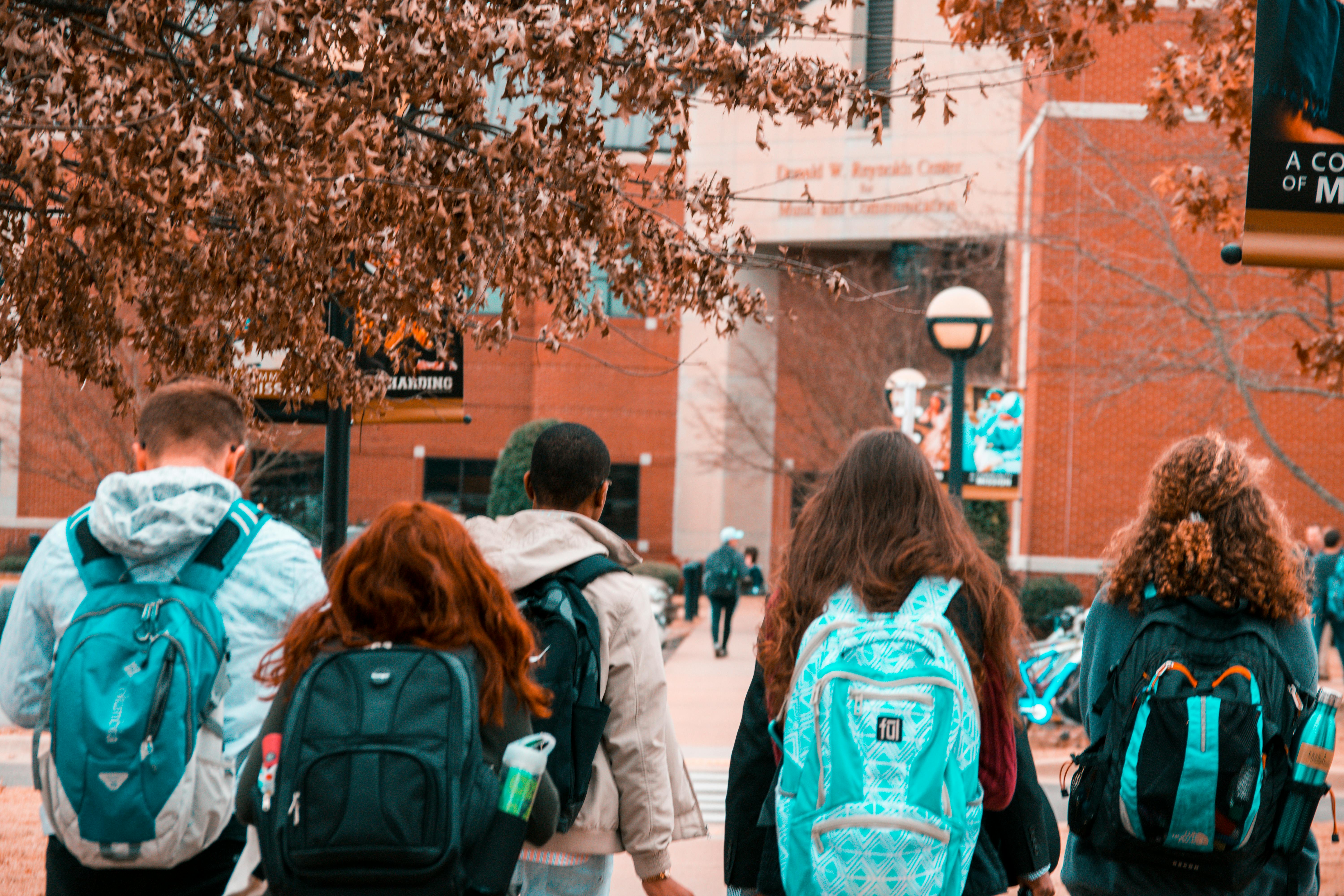 Students with back packs walking to school